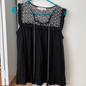 Black loft top with eyelet detail at top